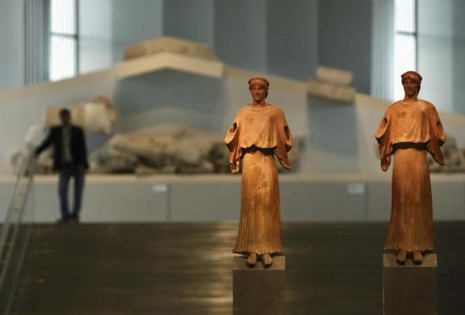 Two 1st-3rd century AD. terracotta statues are on display at the entrance of the new Acropolis museum in Athens, June 17, 2009. 